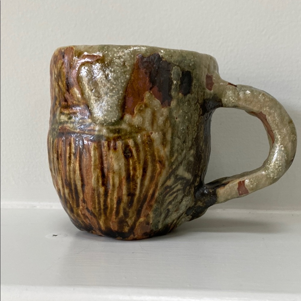 Handcrafted Ceramic Mug with Earthy Tones